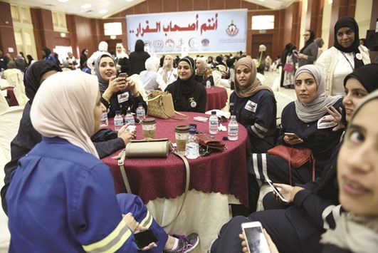Female oil sector employees sit in a hall on the first day of an official strike called by the Oil and Petrochemical Industries Workers Union over public sector pay reforms, in Ahmadi, Kuwait yesterday. The Opec memberu2019s production dropped to 1.1mn bpd, Saad al-Azmi, deputy chief executive for finance and spokesman at Kuwait Oil Co, said in posts on Instagram and Twitter yesterday when workers walked off the job.