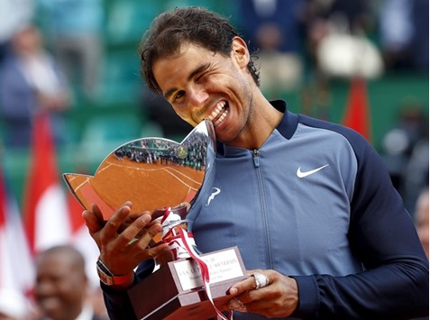 Rafael Nadal of Spain poses with the trophy after winning the Monte Carlo Masters . (Reuters)