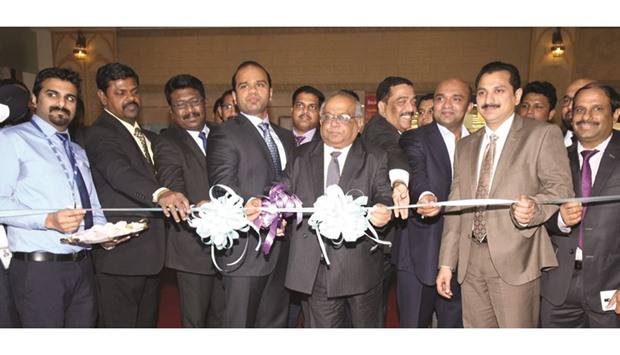Ahamed cutting a ribbon to inaugurate the new branch of LuLu Exchange Company at Al Khor Mall.