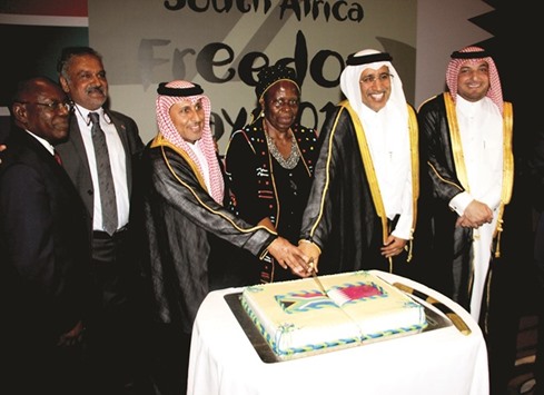 CELEBRATION: South African Deputy Minister for Arts and Culture Rejoice Mabudafhasi cutting the cake with Qatari dignitaries as ambassador Saad Cachalia, second left, looks on.