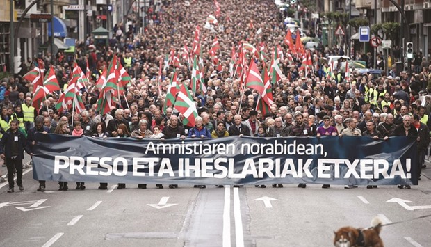 People march in Bilbao behind a banner reading u2018Amnesty. Prisoners and Exiles Homeu2019 in support of ETA prisoners and exiles.
