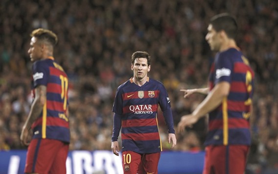 Barcelonau2019s Luis Suarez (R), Neymar and Lionel Messi (C) during their La Liga match against Valencia on Sunday. (Reuters)