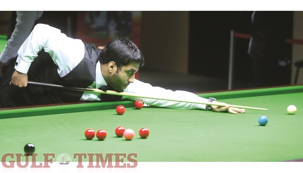 Qataru2019s Mhanna Alobaidli in action against Iraqu2019s Alijalil Ali during their Asian Snooker Championship Group E match yesterday. Alobaidli lost a close game 3-4. PICTURES: Jayan Orma