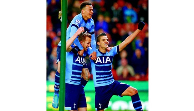 Harry Kane (L) celebrates with teammates after scoring the third goal for Tottenham against Stoke City. (Reuters)