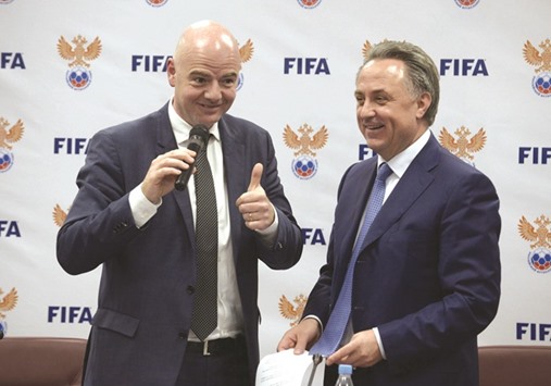 FIFA President Gianni Infantino (L) gives a thumb up next to president of the Russian Football Union Vitaly Mutko (R) during a a press conference at the Russian Football Unionu2019s headquarters in Moscow yesterday. (AFP)