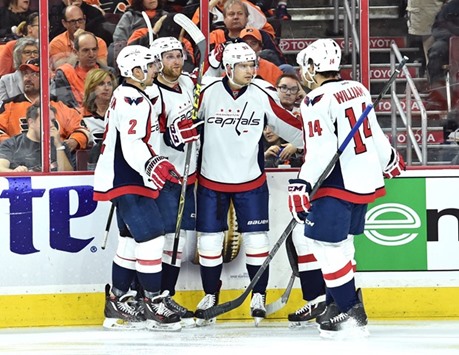 Washington Capitals players celebrate a goal.