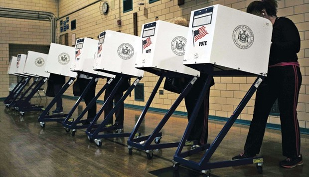 Residents cast their ballots in New York yesterday.