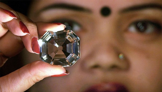 An Indian model displaying a replica of the famous Indian 'Koh-i-Noor' diamond to the meida. File picture.