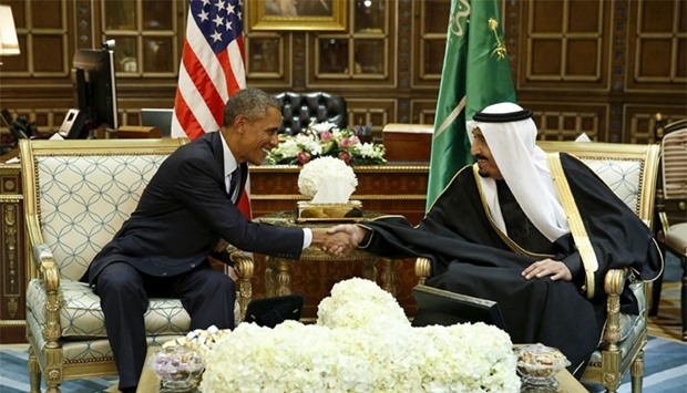 US President Obama shakes hands with Saudi Arabia's King Salman at the start of a bilateral meeting at Erga Palace in Riyadh