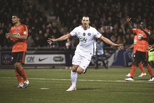 Paris Saint-Germainu2019s Swedish forward Zlatan Ibrahimovic (C) celebrates after scoring a goal during the French Cup semi-final football match against Lorient (FCL).
