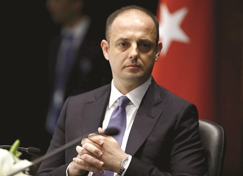 Turkeyu2019s new central bank governor Murat Cetinkaya attends a brief ceremony at which he officially took over from outgoing governor Erdem Basci in Ankara on Tuesday. The 40-year-old Cetinkaya, the first Islamic finance specialist to hold the position of central bank  governor in constitutionally secular Turkey, has taken his position at a time when investors are concerned about potential government pressure on monetary policy.