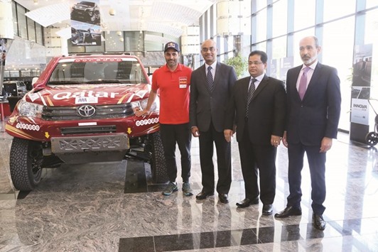 Nasser Saleh al-Attiyah with AAB officials at a press conference.