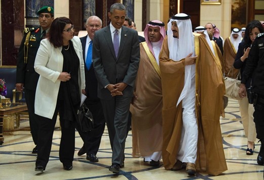 US President Barack Obama speaks with Custodian of the Two Holy Mosques King Salman of Saudi Arabia at Erga Palace in Riyadh yesterday.