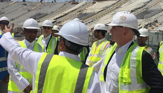 FIFA president Gianni Infantino (right) is briefed by officials during a visit to the Khalifa International Stadium on Thursday.