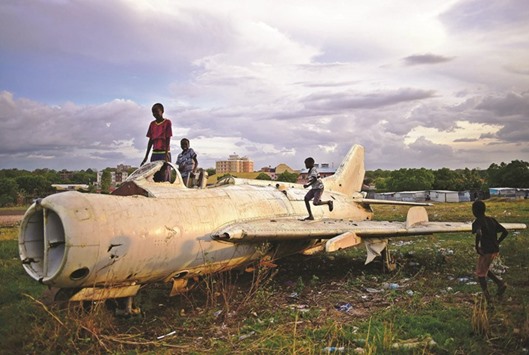 Children play on a destroyed fighter plane in Juba. Fragile hopes for an end to South Sudanu2019s civil war are being tested by the rebel leaderu2019s failure to return to the capital to form a unity government. International pressure is growing after Riek Machar, a former rebel leader turned deputy president who was fired, became a rebel leader again and has now fought his way back to the vice presidency, failed to appear in Juba as expected earlier this week.