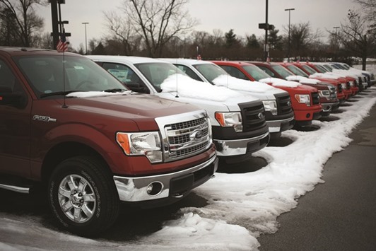 A row of 2015 Ford Motor F-150 trucks are displayed for sale at a car dealership in Louisville, Kentucky, US in this photo taken on February 25, 2015. The 2015 F-150, which gets as few as 13 miles to the gallon, was the top selling vehicle in the US last year, according to GoodCarBadCar.net, which tracks sales.