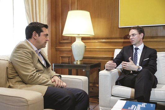 Greek Prime Minister Alexis Tsipras (left) meets European Commission vice-president Jyrki Katainen in his office in the Maximos Mansion in Athens. Talks on pension reforms, tax hikes, privatisations and the management of bad loans resumed this week in Athens with the aim of reaching an agreement on the package before eurozone finance ministers meet in Amsterdam today to assess the progress.