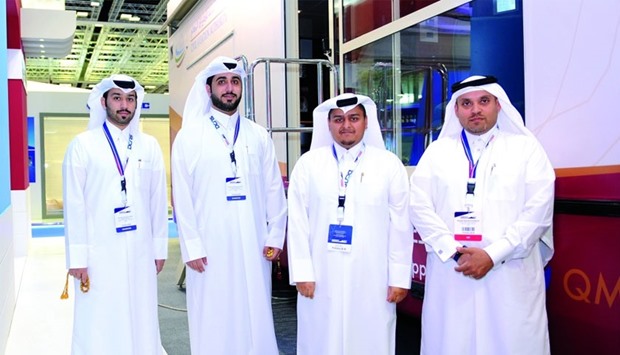 Abdulla al-Mannai, right, and his colleagues in front of the QCAA mobile van at the recently-concluded Dimdex 2016