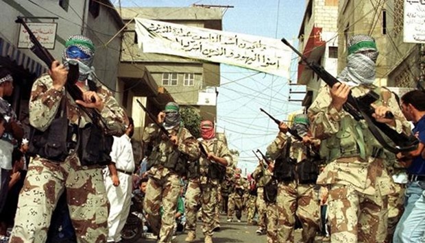 Gunmen march through Sidon's Ain al-Helweh camp. AFP