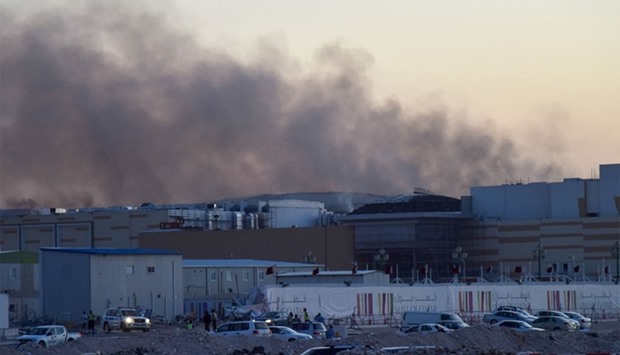 Plumes of smoke emanating from the affected portion of the under-construction Mall of Qatar yesterday. PICTURES: Noushad Thekkayil          