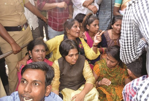 Activists including Trupti Desai gather as they attempt to enter the Shani Shingnapur temple in Ahmednagar, some 200km east of Mumbai yesterday.