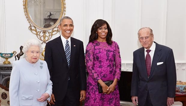 Queen Elizabeth II, President Barack Obama, US First Lady Michelle Obama and Prince Philip, Duke of Edinburgh, pose for a photograph in the Oak Room ahead of a private lunch at Windsor Castle in Windsor, southern England, on Friday.