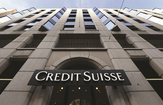 A logo is seen on a branch of the Credit Suisse in Geneva. Credit Suisse is pitching a plan to farm out some of its risk from potential losses linked to events like rogue trading and cybercrime, according to reports.
