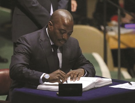 Congo President Kabila signing the Paris Agreement on climate change at United Nations Headquarters in Manhattan, New York yesterday. He has pledged to reform agriculture in the Congo.