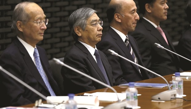 Bank of Japan governor Haruhiko Kuroda (2nd from left) attends the BoJ quarterly branch manageru2019s meeting with deputy governor Hiroshi Nakaso (2nd from right), board members Takehiro Sato (right) and Koji Ishida at the central banku2019s headquarters in Tokyo. With inflation hovering near zero, growth well below the governmentu2019s target and gains in the yen threatening to drive prices even lower, the BoJ will expand stimulus at its policy meeting next week, according to 23 of 41 analysts surveyed by Bloomberg.