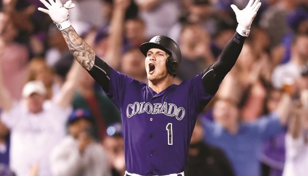 Colorado Rockies centre fielder Brandon Barnes celebrates after hitting a two RBI triple in the eighth inning against the Los Angeles Dodgers at Coors Field. PICTURE: USA TODAY Sports
