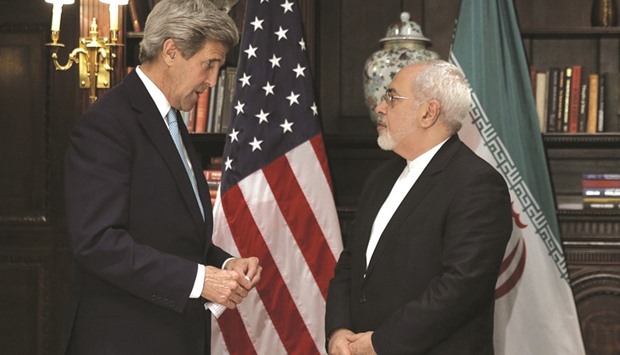 US Secretary of State John Kerry (left) meets with Iranu2019s Foreign Minister Mohammad Javad Zarif in Manhattan, New York City on Friday. Kerry and Zarif resumed talks started earlier this week aimed at freeing up anywhere from $50bn to $100bn Iran holds abroad that was originally frozen by UN sanctions over the countryu2019s nuclear programme.