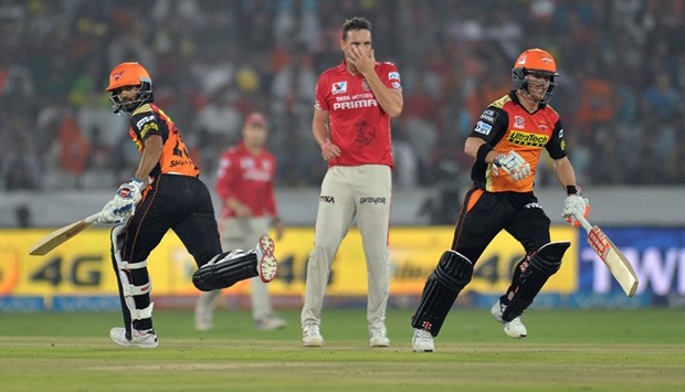 Sunrisers Hyderabad openers David Warner (right) and Shikhar Dhawan run between the wickets during their 90-run opening stand against Kings XI Punjab in Hyderabad yesterday. (AFP)