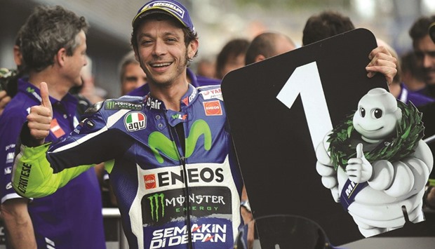 Movistar Yamahau2019s Italian rider Valentino Rossi celebrates after securing the pole position for Spanish Grand Prix at the Jerez racetrack. (AFP)