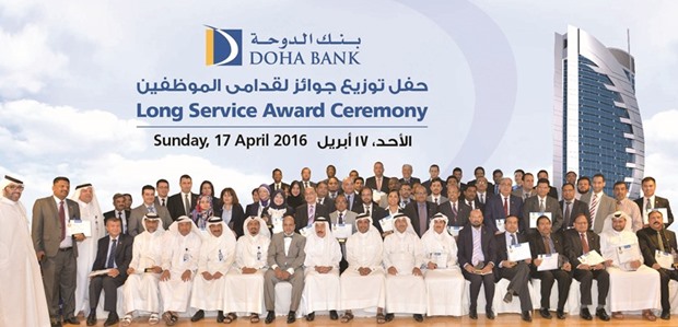 Doha Bank officials at a ceremony honouring the banku2019s long-serving employees.