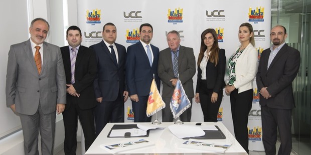 KidzMondo Doha and UCC officials at the agreement-signing ceremony.