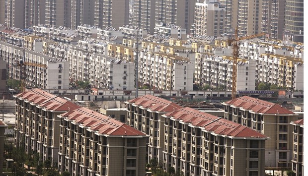 Buildings of a residential compound in Huaibei, Anhui province. Chinau2019s construction, property, finance and consumer service sectors contribute 80% of the countryu2019s total business tax revenue, which in turn accounts for about 40% of total provincial government revenues.
