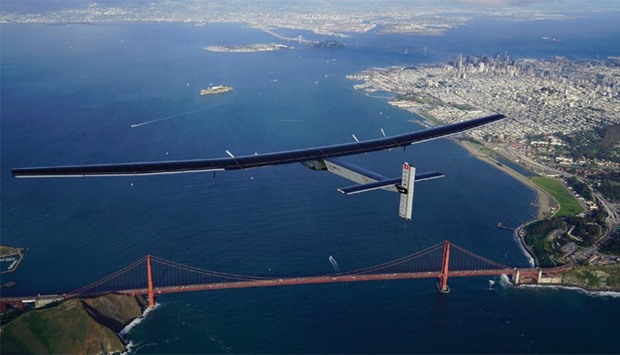 ,Solar Impulse 2,piloted by Swiss adventurer Bertrand Piccard, flies over the Golden Gate Bridge