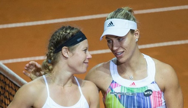 Germany's Angelique Kerber (right) comforts fellow German Laura Siegemund after winning the WTA Tennis Grand Prix in Stuttgart on Sunday.