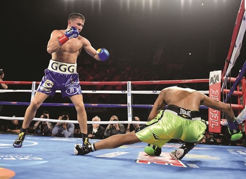 Gennady Golovkin of Kazakhstan knocks down Dominc Wade for the second time on way to a second round TKO during his unified middleweight title fight on Saturday. (AFP)
