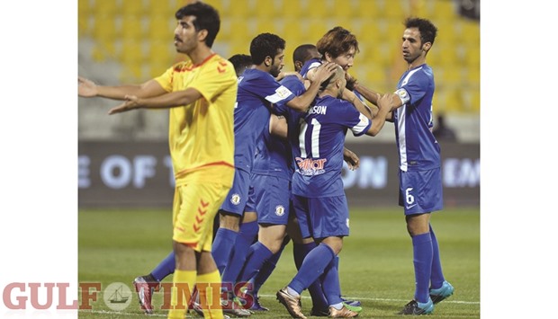 Al Khor players (in blue) celebrate a goal against Mesaimeer during their Emir Cup match at Suhaim bin Hamad Stadium on Saturday. Khor won 2-1. PICTURE: Noushad Thekkayil