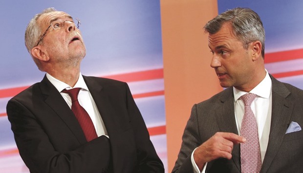 Presidential candidates van der Bellen (left) and Hofer are seen during a TV debate in Vienna.