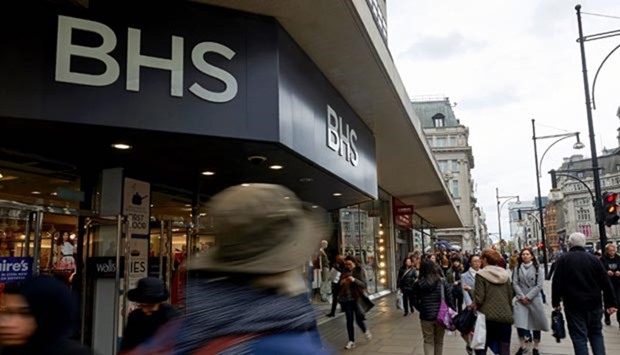 Pedestrians walk past the entrance to a BHS store on Oxford Street in central London on Monday.