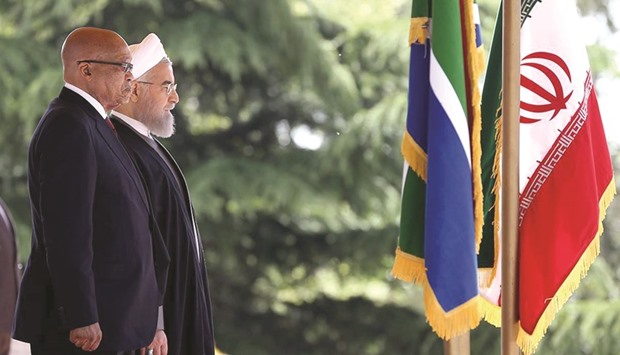 Iranian President Hassan Rouhani reviewing the honour guard with South African President Jacob Zuma during a ceremony at the presidential palace in Tehran yesterday.
