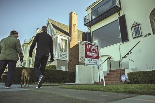 Pedestrians walk past a home for sale in San Francisco (file). Purchases of new homes in the US unexpectedly declined in March for a third month, reflecting the weakest pace of demand in the West since July 2014.