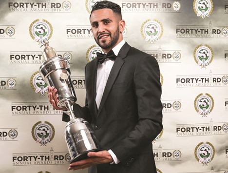 Leicester Cityu2019s Riyad Mahrez poses with his PFA Player of the Year award.