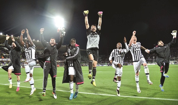 Juventusu2019 players celebrate after their win over Fiorentina at the Artemio Franchi stadium in Florence.  (AFP)
