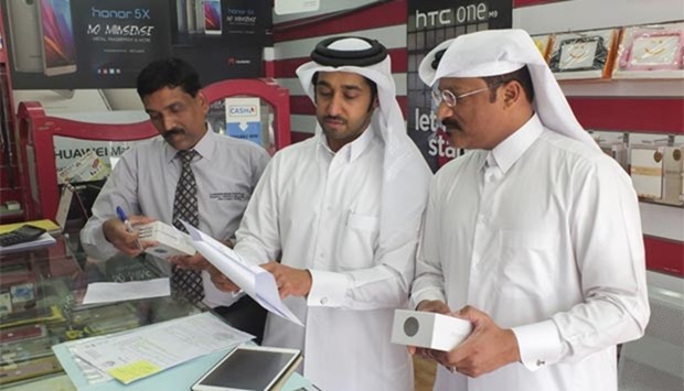 CRA inspectors conducting an inspection at a shop.