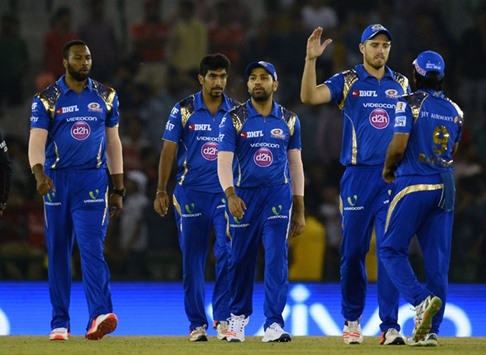 Mumbai Indians captain Rohit Sharma (centre) walks back with teammates after winning their Indian Premier League (IPL) match against Kings XI Punjab in Mohali yesterday. (AFP)