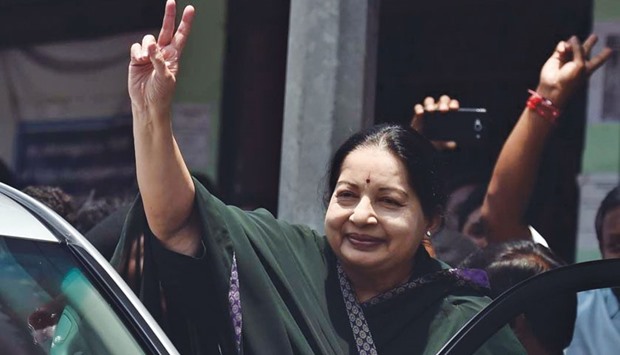 Tamil Nadu Chief Minister J Jayalalithaa flashes a victory sign after filing her nomination papers in Chennai yesterday.