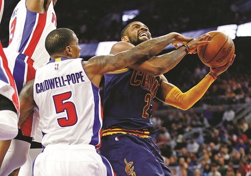 Kyrie Irving #2 of the Cleveland Cavaliers tries to get to the basket in the third quarter past Kentavious Caldwell-Pope #5 of the Detroit Pistons in game four.